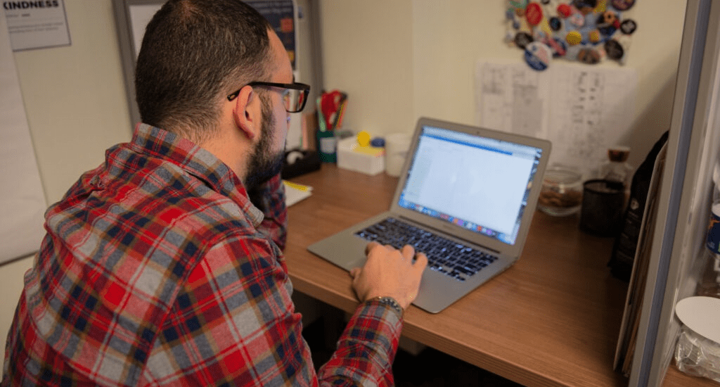 A student works on their laptop.