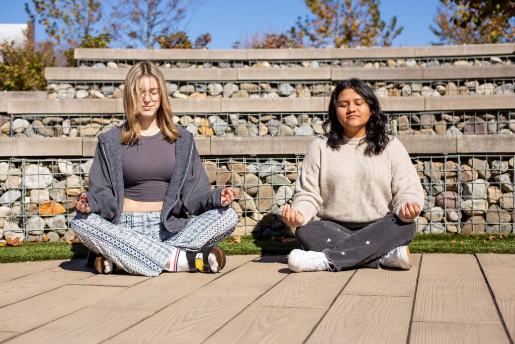 Students practice yoga