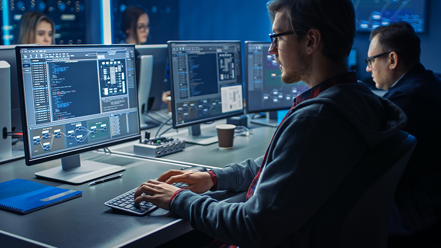 A student works on a desktop computer.