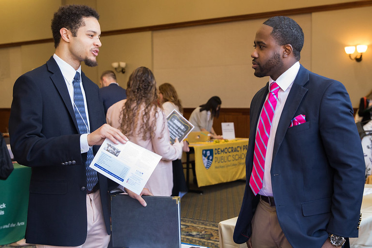 two people talking at a career fair