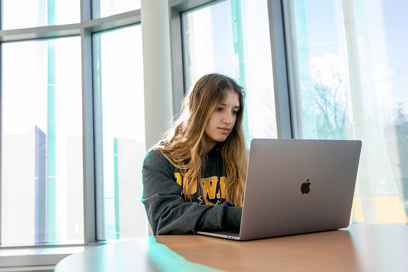 student on her computer looking something up